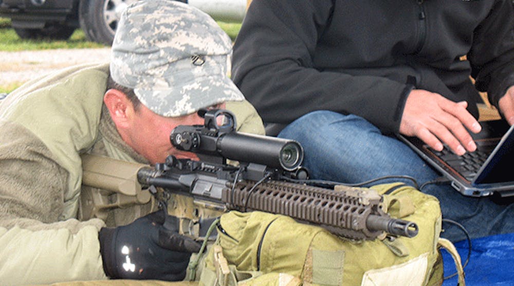 A member of the U.S. Army&rsquo;s Special Forces demonstrates the Razar adaptive-zoom riflescope developed at Sandi National Laboratory.