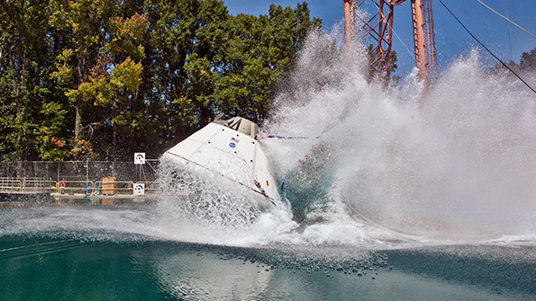 A mockup of NASArsquos Orion space capsule was drop tested from a variety of heights speeds and angles to determine the estimated vertical and horizontal velocities it will be going when it parachutes into the ocean Data recorders monitored a wide variety of parameters to ensure the spacecraft would withstand the stresses of impact with the water