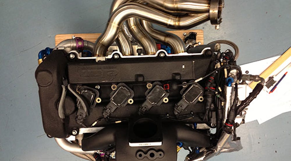 A 3-D printed intake manifold for a DeltaWing race car was made out of Windform XT 2.0 in order to simplify manufacturing and decrease the weight of the automobile, all while withstanding high temperatures and pressures of the gearbox oil.