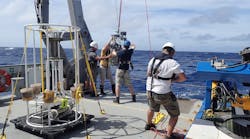 Woods Hole Oceanographic Institution scientists aboard the Schmidt Ocean Institute&rsquo;s R/V Falkor prepare to lower the rosette responsible for collecting microbes in dead-zone regions.