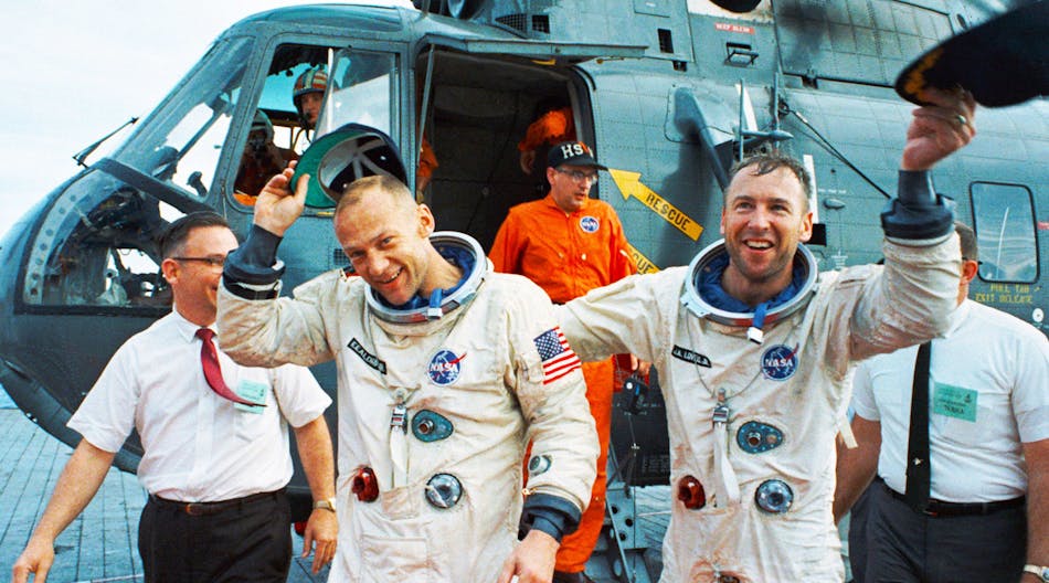 Co-pilots Jim Lovell and Buzz Aldrin celebrate after the Gemini XII splashdown on November 15, 1966.