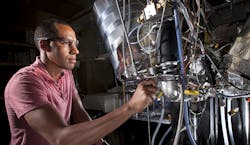 Sandia researchers Isaac Ekoto pictured and Benjamin Wold are part of a team researching automotive engines that replace sparkplugs with autoignition devices The research could help meet automotive engine goals for cleaner emissions and a 545 miles per gallon fuel economy by 2025 Sandia researchers Isaac Ekoto pictured and Benjamin Wold are part of a team researching automotive engines that replace sparkplugs with autoignition devices The research could help meet automotive engine goals for cleaner emissions and a 545 miles per gallon fuel economy by 2025