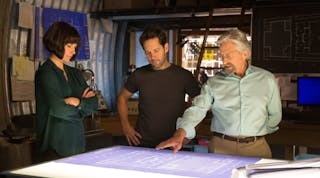 The image above, provided by Marvel.com, shows Hank Pym (Michael Douglas), Scott Lang (Paul Rudd), and Hope Van Dyne (Evangeline Lilly), analyzing blueprints and tech designs in the upcoming Ant-Man movie.