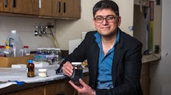 Gurpreet Singh from Kansas State University holds his invented black ceramic derived from a clear liquid silazane polymer enhanced with boron. (Courtesy of Kansas State University)