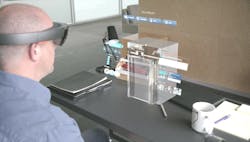 Technician wearing HoloLens Technician wearing HoloLens