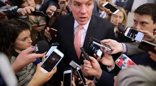 Senator Mark Warner speaks with reporters following the announcement of the Internet of Things Cybersecurity Improvement Act of 2017.