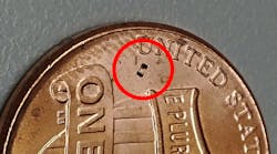 The microbot, &micro;TUM, can be seen just below the &ldquo;U&rdquo; in the United States on this penny.