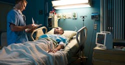 Patient in hospital bed Patient in hospital bed