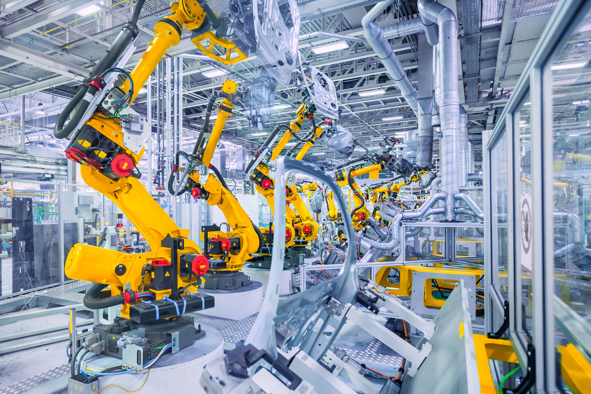 Robotic arms in a car plant