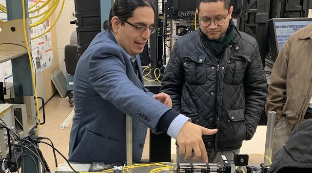 Eden Figueroa describes the inner workings of the quantum network hardware at Brookhaven National Laboratory as Robinson Pino, acting director of Computational Science Research and Partnerships Div. overseen by DOE&rsquo;s Advanced Scientific Computing Research program office, looks on.