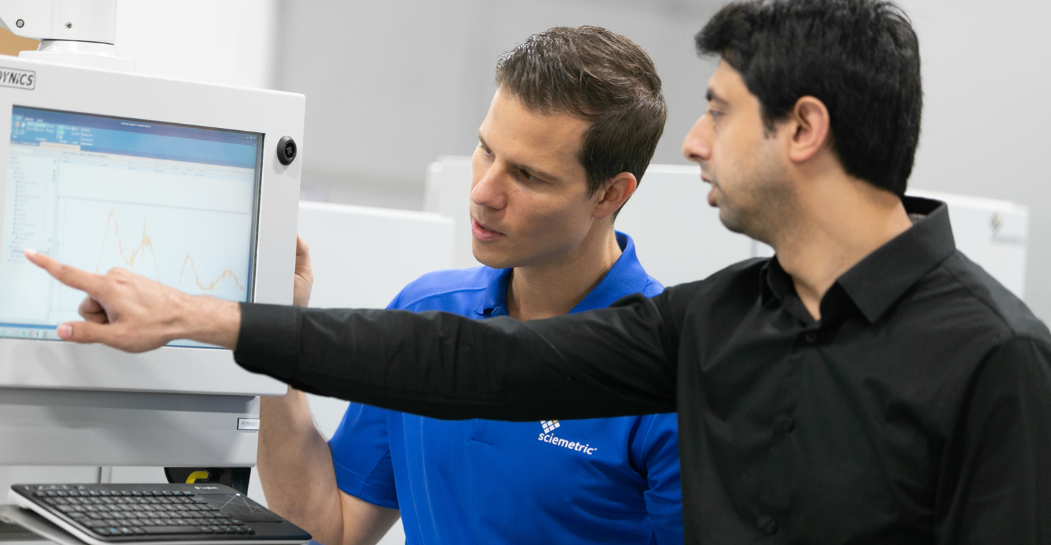 Two men reviewing data