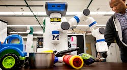 Odd Job, one of two Michigan University robots , grabs for an object. Odd Job and its double, Cookie, can grab objects based on depth and color perception.