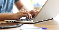 Person typing on laptop Person typing on laptop