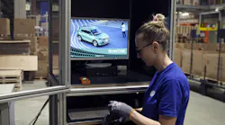 Employee donning charged scanner