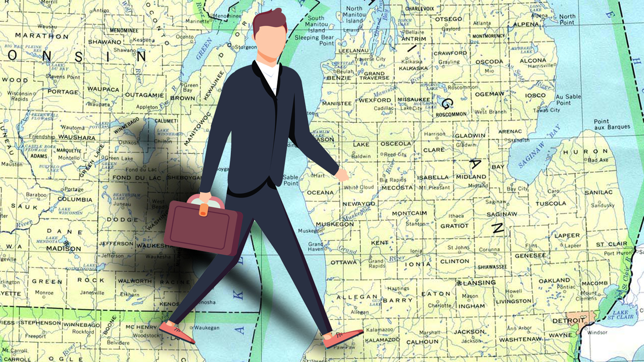 Businessman walking over map of Michigan