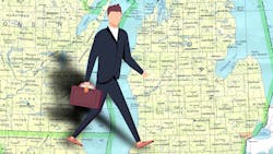 Businessman walking over map of Michigan Businessman walking over map of Michigan