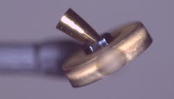 The cone-shaped, 1-millimeter gold CPC is attached to a 500-micron-thick gold foil. Between the cone and the foil is a plastic support. The target was produced and assembled by Willie Hooke of General Atomics. The cone-shaped, 1-millimeter gold CPC is attached to a 500-micron-thick gold foil. Between the cone and the foil is a plastic support. The target was produced and assembled by Willie Hooke of General Atomics.