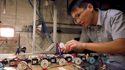A Johns Hopkins engineer works on a robot that mimics a snake to climb stairs and other obstacles. A Johns Hopkins engineer works on a robot that mimics a snake to climb stairs and other obstacles.