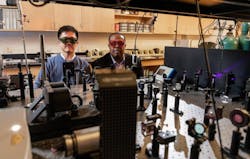 Researchers Cheng Zhe and Samuel Graham are shown with an optical test setup for studying gallium nitride devices cooled by placement on a diamond substrate.