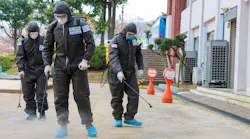 Soldiers using disinfectant