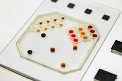 Ferrobots can move around drops of fluid. The underlying robotic mechanism is electromagnetic actuation of miniature mobile magnets. Ferrobots can move around drops of fluid. The underlying robotic mechanism is electromagnetic actuation of miniature mobile magnets.