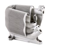 Metal AM is a design-driven manufacturing process that makes possible many organic shapes and features, such as this lamellar heat exchanger part. Metal AM is a design-driven manufacturing process that makes possible many organic shapes and features, such as this lamellar heat exchanger part.