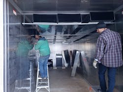 Andrew Barnard and a colleague work on one of the heating ducts in the MTU sanitizer. Andrew Barnard and a colleague work on one of the heating ducts in the MTU sanitizer.