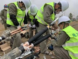 Workers install the electrical system at the Huoshenshan Hospital in Hubei Province, China. The hospital was constructed in just 10 days to meet the needs of the province, which was the first global hotspot in the global pandemic. Workers install the electrical system at the Huoshenshan Hospital in Hubei Province, China. The hospital was constructed in just 10 days to meet the needs of the province, which was the first global hotspot in the global pandemic.