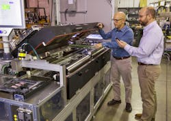 At the Pensar Otra Vez facility, D2 Engineering&rsquo;s Dan Distefano (left) and Beckhoff&rsquo;s Regional Sales Engineer inspect the redesigned PCB handler for conducting tests.
