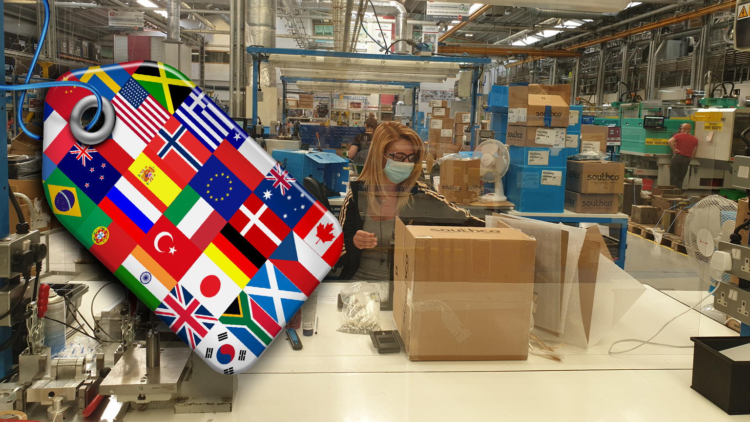 Social distancing on plant floor, with flags