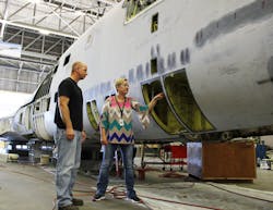 Dr. Melinda Laubach-Hock, director of Sustainment at National Institute for Aviation Research (NIAR), supervises all mechanics inspectors and is the program manager on the digital-twins program. Here she confers with Brian Ploutz, lead tear-down mechanic at NIAR.