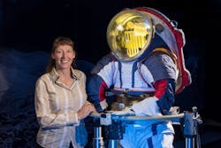 Advanced spacesuit designer Amy Ross of NASA’s Johnson Space Center stands with the Z-2, a prototypical spacesuit. Advanced spacesuit designer Amy Ross of NASA’s Johnson Space Center stands with the Z-2, a prototypical spacesuit.