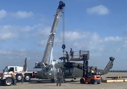 A UH-60L Black Hawk helicopter is loaded at Corpus Christi Army Depot in preparation for its trip to Wichita State University and the National Institute of Aviation Research (NIAR), where a virtual model of the workhorse will be created.