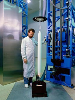 In this stage of production, the silicon filament narrows to its desired width, cools and passes through a laser micrometer before being pulled onto a take-up spool. In this stage of production, the silicon filament narrows to its desired width, cools and passes through a laser micrometer before being pulled onto a take-up spool.