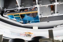 A raft of nine CCD sensors is hoisted into place to form part of the LSST’s focal planet. Specialty rafts (on the left) are smaller, containing only three sensors, and will be used to focus and synchronize the camera. A raft of nine CCD sensors is hoisted into place to form part of the LSST’s focal planet. Specialty rafts (on the left) are smaller, containing only three sensors, and will be used to focus and synchronize the camera.