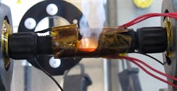 If there were a spark, a polymer within the in-line connectors would melt and a spring extend inside of it to widen the spark gap and stop the flames, as shown in this photo. If there were a spark, a polymer within the in-line connectors would melt and a spring extend inside of it to widen the spark gap and stop the flames, as shown in this photo.