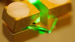 A photoconductive switch made from a synthetic diamond is tested at LLNL under test. A photoconductive switch made from a synthetic diamond is tested at LLNL under test.