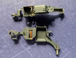 Small components of a hearing aid. Small components of a hearing aid.