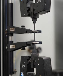 Rubber suppliers test their materials to ensure they meet demanding specifications. Here rubber is stretch tested. Rubber suppliers test their materials to ensure they meet demanding specifications. Here rubber is stretch tested.