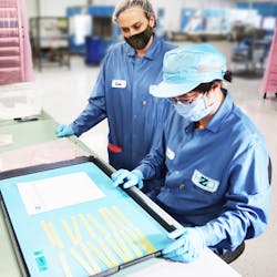 Lisa Rizzo (left), director of Product Management at HZO, consults with a colleague. Lisa Rizzo (left), director of Product Management at HZO, consults with a colleague.