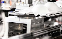 The work cell is designed so it can be adapted to make masks for a variety of medical procedures. The work cell is designed so it can be adapted to make masks for a variety of medical procedures.