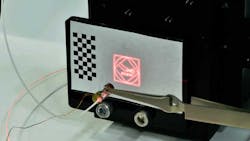 5. Using a non-surgical red laser, the steerability and repeatability of the beam is sketched on a flat surface in early trials. 5. Using a non-surgical red laser, the steerability and repeatability of the beam is sketched on a flat surface in early trials.