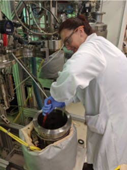 A researcher at Berkeley Lab prepares woody biomass to be broken down into fermentable sugars.