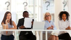 A table of people pondering a question A table of people pondering a question