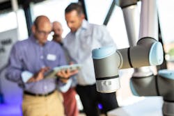 UR workers with cobot in foreground UR workers with cobot in foreground