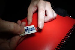 This image shows a small hydrogel (right) collecting sweat from the fingertip for the vitamin-C sensor (left), then displaying the result on the electrochromic display. This image shows a small hydrogel (right) collecting sweat from the fingertip for the vitamin-C sensor (left), then displaying the result on the electrochromic display.