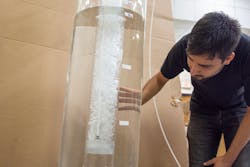 Ansan Pokharel, mechanical and aerospace engineering graduate student, tests the improved sparger design created by West Virginia University engineers. Ansan Pokharel, mechanical and aerospace engineering graduate student, tests the improved sparger design created by West Virginia University engineers.