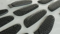 This image shows the latticed inserts created out of FPU 50 polyurethane using Carbon&rsquo;s DLS printing process. The thumb inserts have a slight curve and a tab.