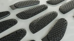 This image shows the latticed inserts created out of FPU 50 polyurethane using Carbon’s DLS printing process. The thumb inserts have a slight curve and a tab. This image shows the latticed inserts created out of FPU 50 polyurethane using Carbon’s DLS printing process. The thumb inserts have a slight curve and a tab.