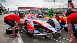 Crew working on Mahindra Formula E car Crew working on Mahindra Formula E car